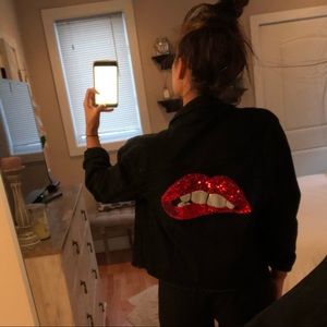 Black distressed jean jacket with lips